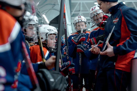 hockey coach with players