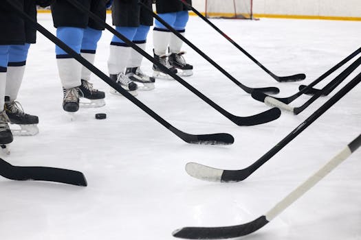 hockey players working on faceoff techniques