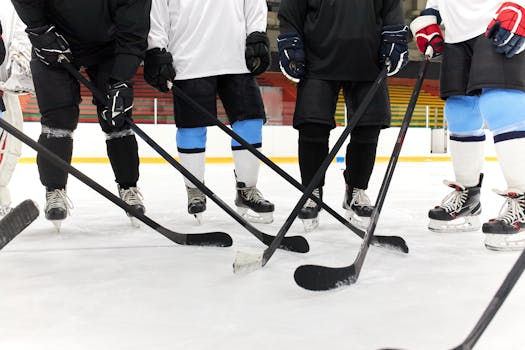 Hockey players executing a power play formation