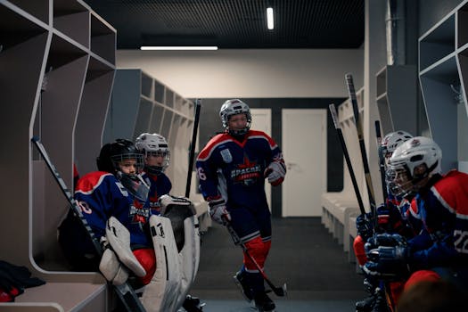 hockey players strategizing during a timeout