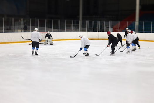 Amateur players practicing teamwork on the ice